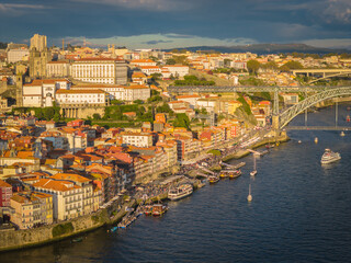 Fototapeta premium Aerial drone view of Dom Luis I Bridge over Douro river and panoramic Porto view. Portugal city landscape