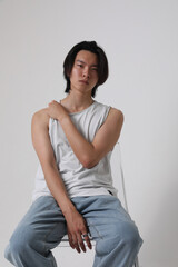 Obraz premium Headshot of thoughtful young man wearing casual clothes posing indoor over white background. Mock-up.