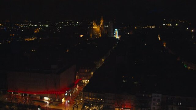 Aerial shot of Centre of Metz by night. Cathedral Saint Etienne visible in the background. Ferris Wheel Illuminated. Red Market. Place de la r&eacute;publique de Metz