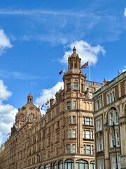 Street View of Harrods in London, England, United Kingdom, on a sunny day