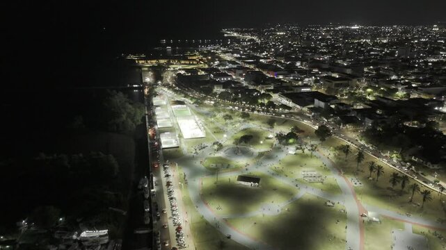 Drone flies south over Pra&ccedil;a Jacy Barata Juca at night in Macap&aacute;, Amap&aacute;, Brazil