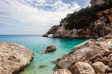 Obraz premium Sardinia. Cala Goloritze. Crystal clear Mediterranean sea, amazing turquoise emerald water, beautiful rocks and cliffs of the Gulf of Orosei, Baunei area, Sardinia, Italy.