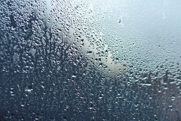 Obraz premium bedroom window pane wet from the inside 