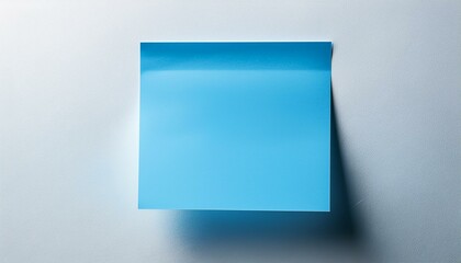 Fototapeta premium Blank Blue Post-it Note on White Wall