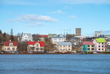 Skyline by lake Tjornin in city of Reykjavik in Iceland