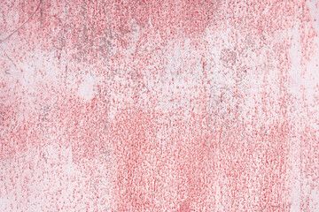Fototapeta premium Fragment of a rusty grunge surface. Dark red background color. Scuffs and peeling of old paint. Scratches and traces of a welding seam.