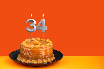 Birthday candle number 34 - Cake with dulce de leche frosting.