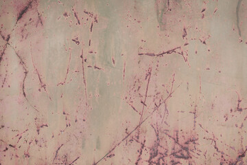 Fragment of a rusty grunge surface. Orange-green background color. Scuffs and peeling of old paint....