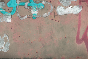 Fragment of a rusty grunge surface. Orange-green background color. Scuffs and peeling of old paint....