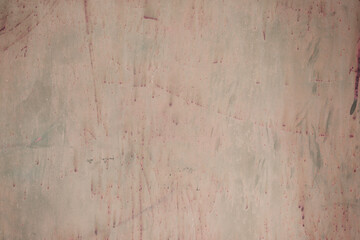 Fragment of a rusty grunge surface. Orange-green background color. Scuffs and peeling of old paint....