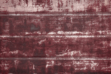Fragment of a rusty grunge surface. Orange-brown background color. Scuffs and peeling of old paint....