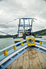 Fishing boat in Paraty Bay, a tourist town and World Heritage Site in Rio de Janeiro, Brazil