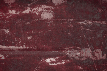 Fragment of a rusty grunge surface. Orange-brown background color. Scuffs and peeling of old paint....
