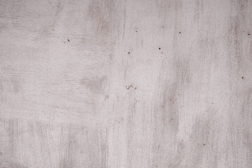 Fragment of a rusty grunge surface. Orange-brown background color. Scuffs and peeling of old paint....