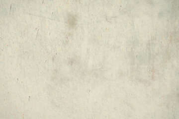 Obraz premium Fragment of a rusty grunge surface. Orange-brown background color. Scuffs and peeling of old paint. Scratches and traces of a welding seam.