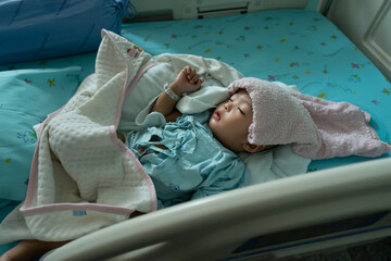 young child patients lying in hospital insert saline line