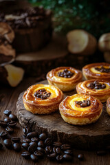 Warm pastries topped with coffee beans, surrounded by rich coffee beans, evoke cozy atmosphere. Perfect for coffee lovers and dessert enthusiasts