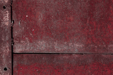 Fragment of a rusty grunge surface. Orange-brown background color. Scuffs and peeling of old paint....