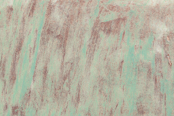 Fragment of a rusty grunge surface. Orange-brown background color. Scuffs and peeling of old paint....