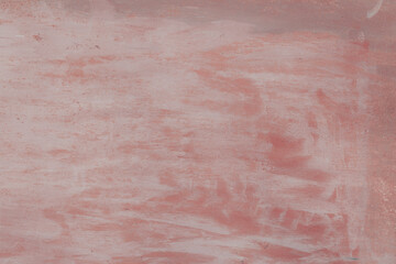 Fototapeta premium Fragment of a rusty grunge surface. Orange-brown background color. Scuffs and peeling of old paint. Scratches and traces of a welding seam.