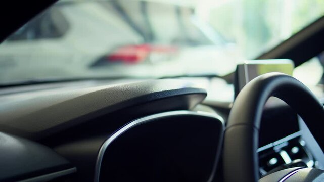 Close up shot of person closing car after using lock controls on panel to unlock it. Automobile owner pulling door handle after using buttons to disengage mechanism latch