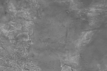 Monochrome texture of a concrete wall with natural relief and damage in the form of chips and...
