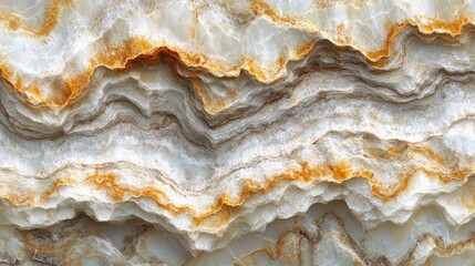 Close-up of white and gold marble with wavy patterns.