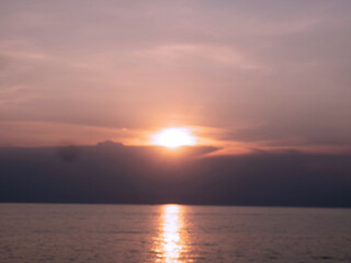 Obraz premium sunset sunrise cloudy white blue sky sea beach vacation holiday nature bright outdoor weather ray sunbeam sunshine season warm relaxation beautiful phenomenon spring idyllic abstract travel trip tour