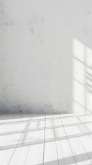 Fototapeta premium A minimalist room with a white wall and shadows creating a serene atmosphere.