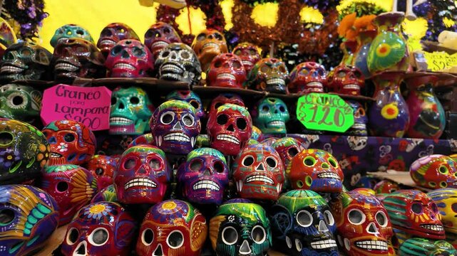 A display of colorful skulls with the sign reading "Granito Lagunero" on the top