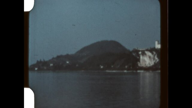 Viewing the Rocca d'Angera 1957 - The Rocca d'Angera, a hilltop fortification above the town of Angera, Italy, is viewed from the town of Arona, across Lake Maggiore, in 1957.