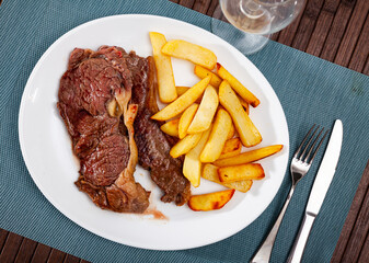 Juicy beef entrecote with baked potato. Delicious homemade dinner..
