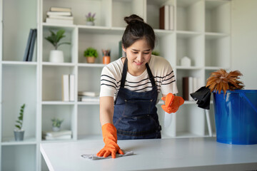 Efficient Cleaning Service Worker Completing Task with Orange Gloves for Spotless Finish