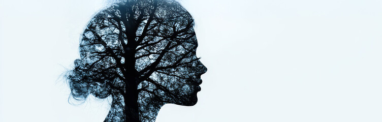A silhouette of a woman's profile merged with a tree, symbolizing the connection between nature and human consciousness.