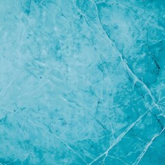 Obraz premium Close-up of a light blue marble surface with a veined pattern.