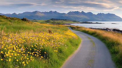 Naklejka premium scenic coastal road lined with vibrant wildflowers, leading to majestic mountains. landscape showcases beauty of nature, with serene atmosphere and colorful blooms