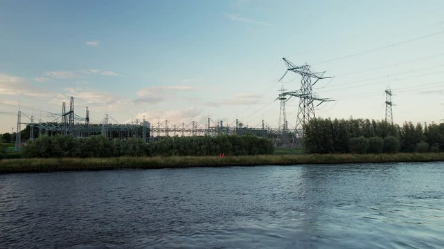 Flying Above Amsterdam-Rhine Canal Towards Power Station In Diemen, Netherlands. drone approach