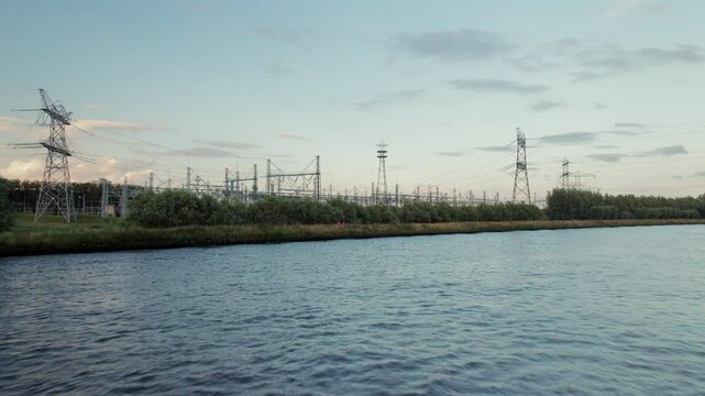 Vattenfall Power Plant From Amsterdam-Rhine Canal In Diemen, Amsterdam. - aerial pullback shot