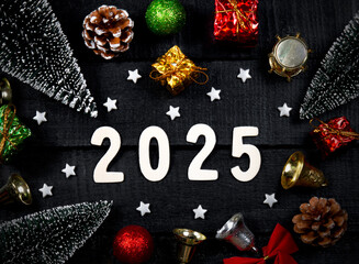 
Happy New Year 2025. Gift boxes, balls, Christmas tree and wooden numbers with the number 2025. New Year's Eve celebration idea.