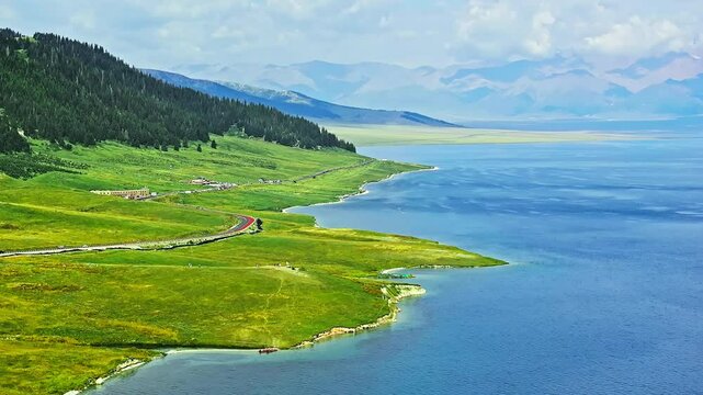 Aerial video of the beautiful Sayram Lake natural landscape in Xinjiang. Famous travel destination in China.