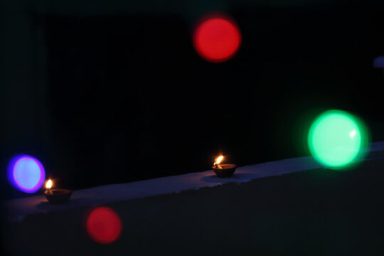A radiant Diwali diya flickers brightly, symbolizing hope, joy, and the triumph of light over darkness.