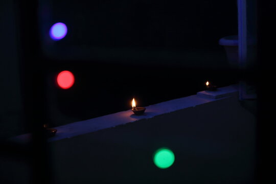 A radiant Diwali diya flickers brightly, symbolizing hope, joy, and the triumph of light over darkness.