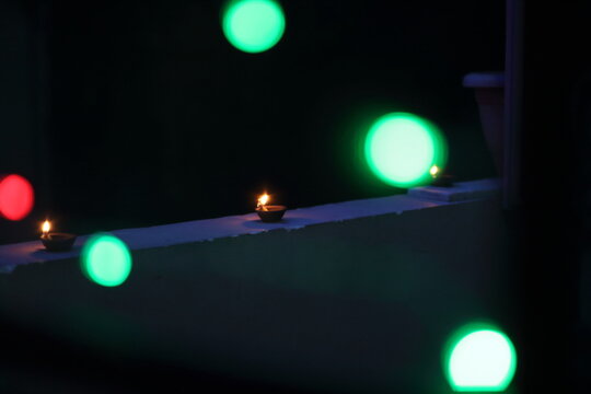 A radiant Diwali diya flickers brightly, symbolizing hope, joy, and the triumph of light over darkness.