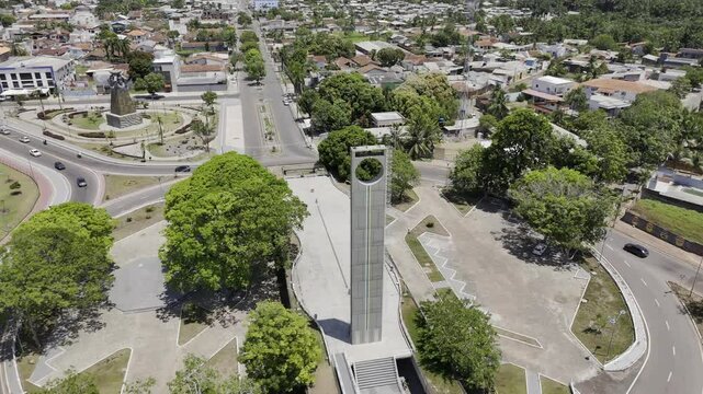 Drone flies up and away from close up of Marco Zero do Equador monument in Macap&aacute;, Amap&aacute;, Brazil