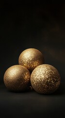 Golden Christmas Baubles on a Black Background.