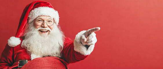 The  Santa Claus in a close-up, holding a red sack