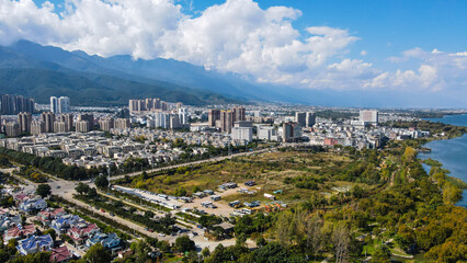 urban riverfront cityscape with mountain background in Dali city,Yunnan,China
