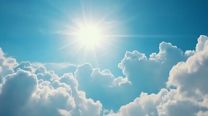 Bright Sun Shining Through Fluffy White Clouds in a Blue Sky
