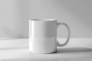 Obraz premium A minimalistic white ceramic mug stands on a bright surface, showcasing its glossy finish and inviting warmth.