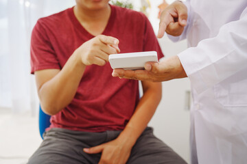 A man consults a doctor in a hospital for a male urinary tract infection. The doctor advises on...